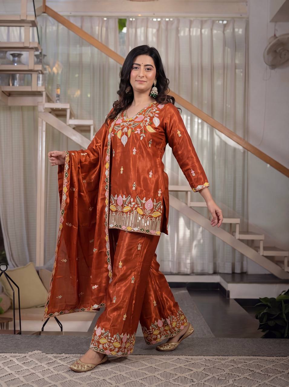 Elegant Rust Orange Silk Kurta and Flared Palazzo Set Adorned with Intricate Multicolored Botanical Embroidery and Mirror Work